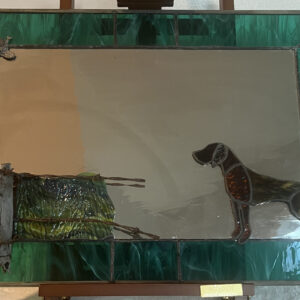 antique mirror trimmed in stained glass and decorated with a German Shorthaired Pointer